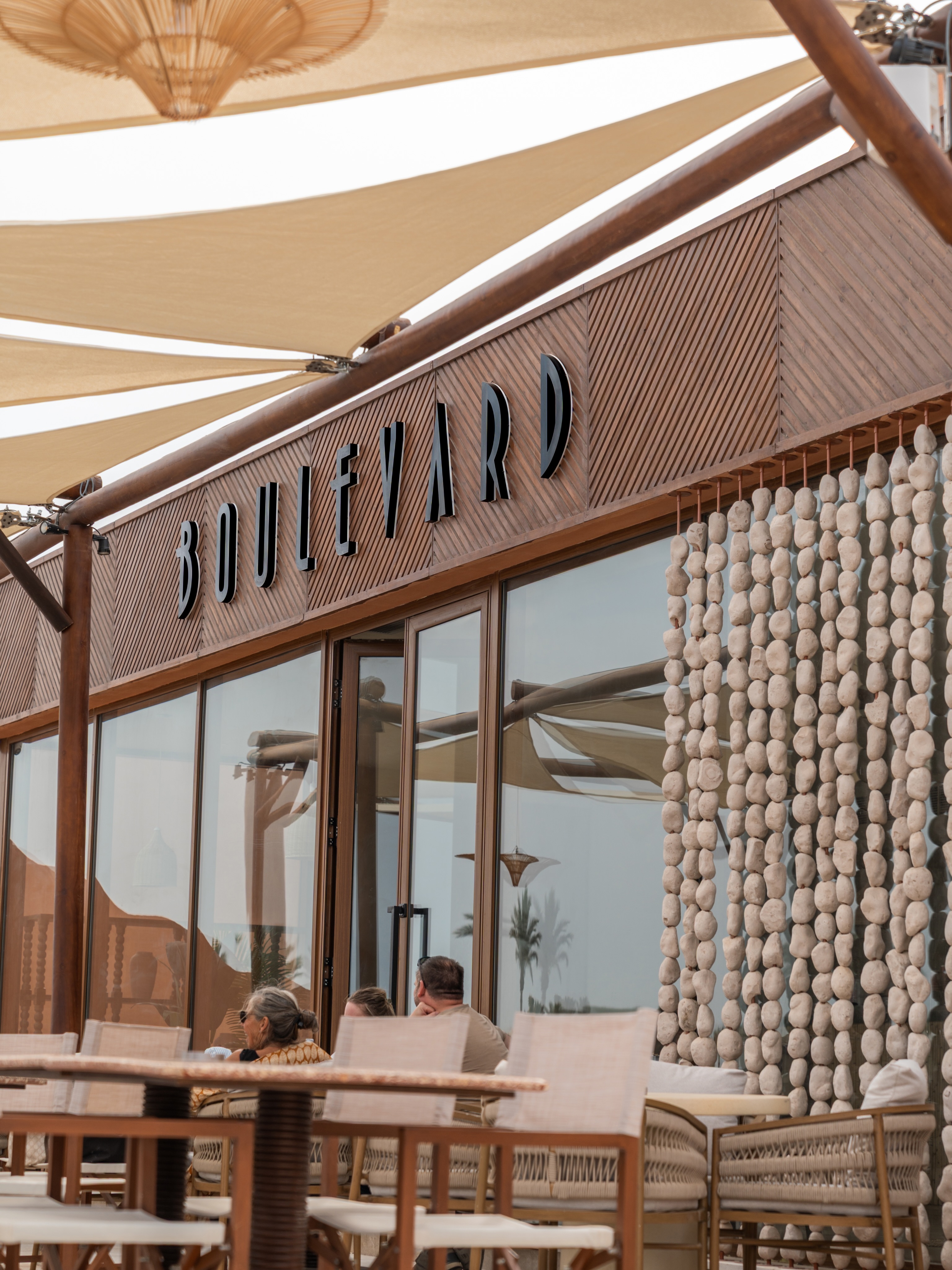 Boulevard exterior signage under shade sails at Seashell, North Coast