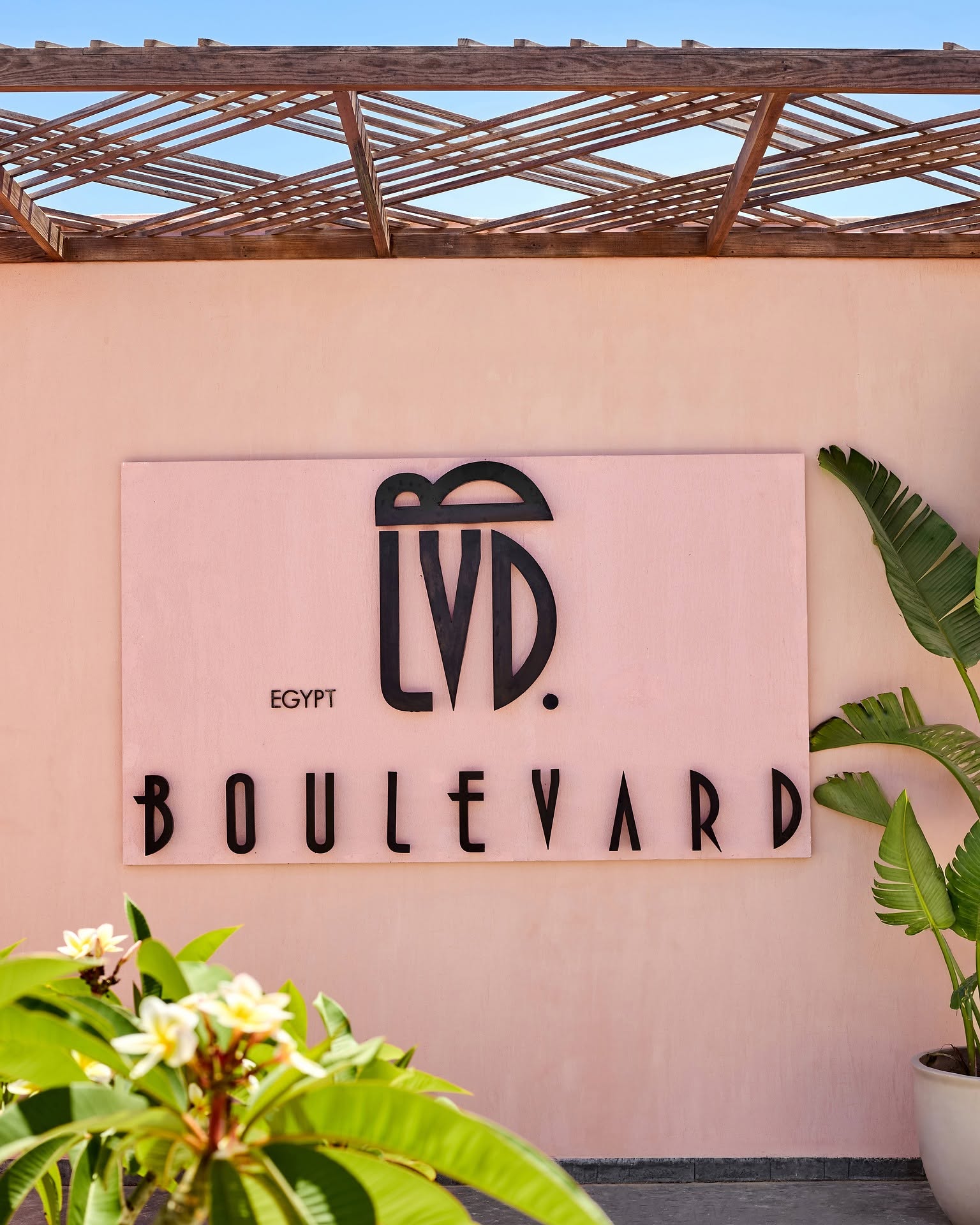 Boulevard LVD. signage on a pink exterior wall