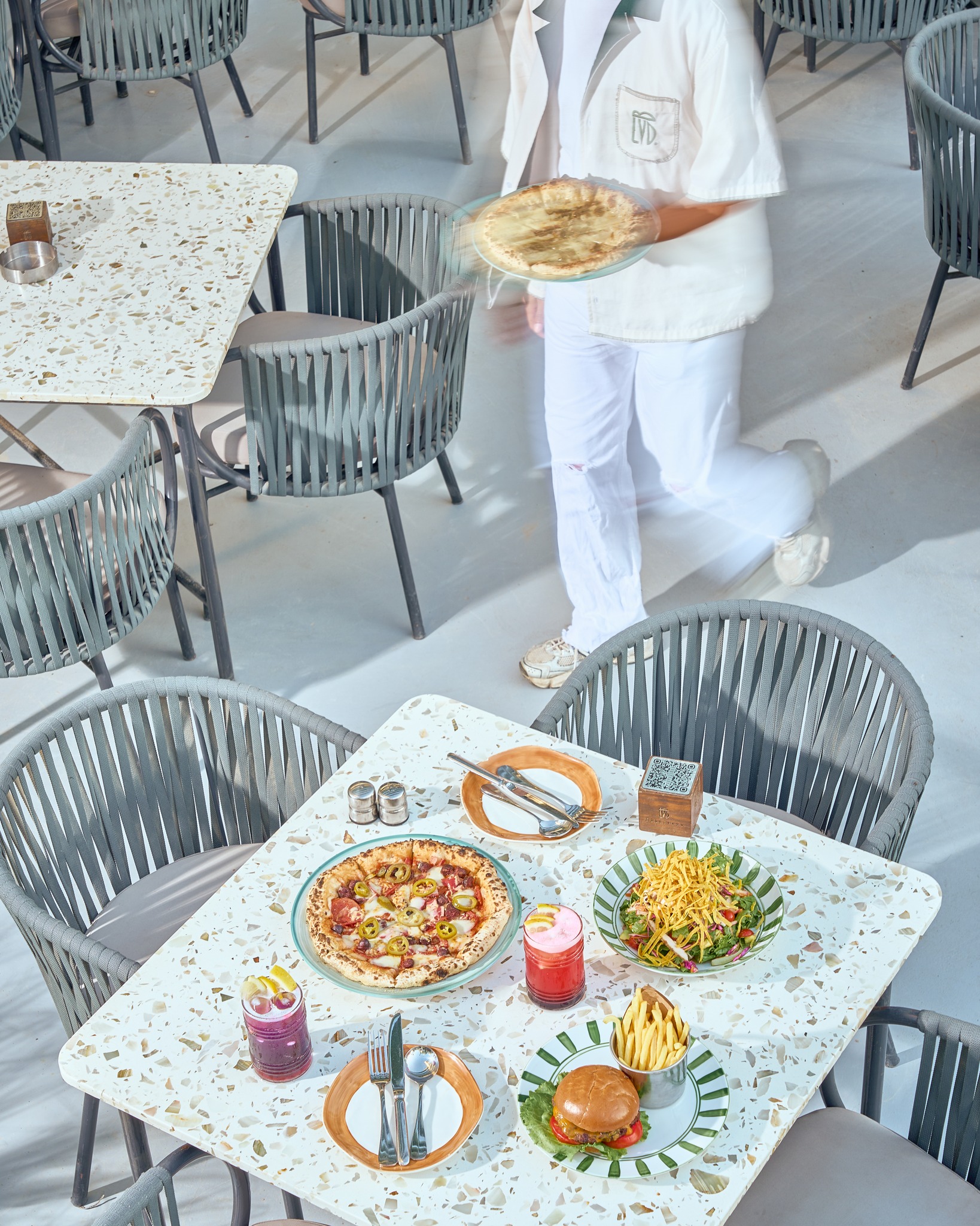 Terrace seating with terrazzo tables seen from above